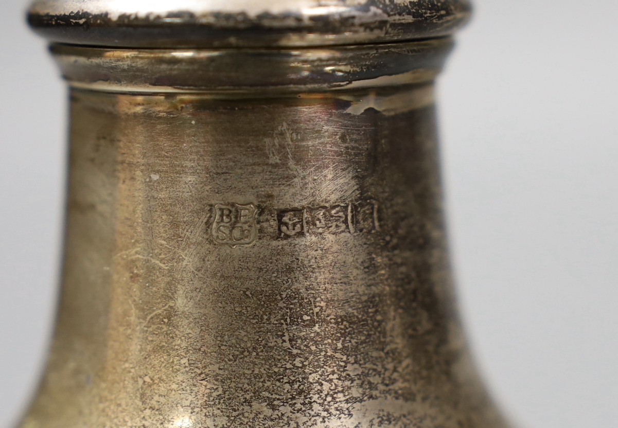 A George V silver baluster caster, Samuel Wood, London, 1759, 17.5cm, two other Georgian silver pepperettes and five late silver casters/pepperettes, gross weight 25oz.